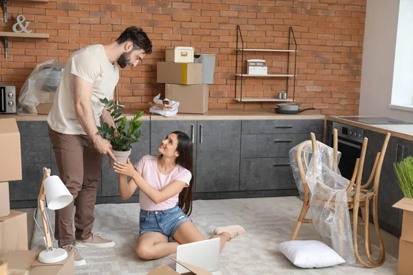Happy young couple after moving into new house — Stock Photo, Image