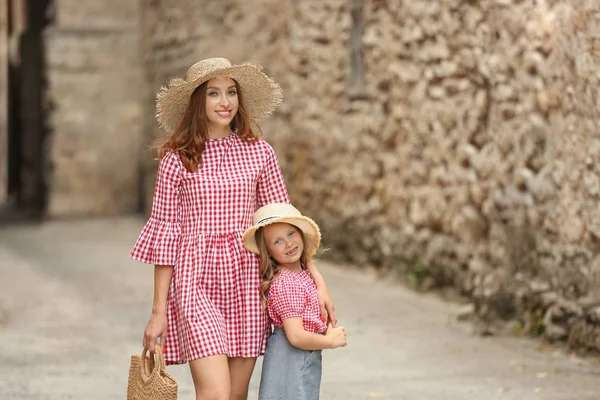 Beautiful woman and her little daughter outdoors — Stock Photo, Image