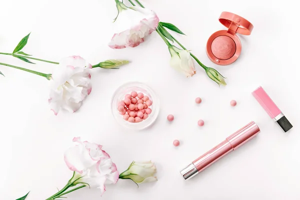 Set of decorative cosmetics with flowers on white background — Stock Photo, Image