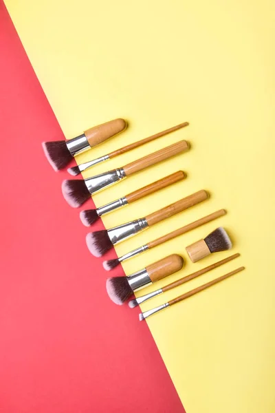 Set of makeup brushes on color background — Stock Photo, Image