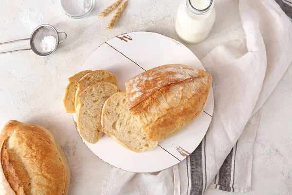 Tasty fresh bread on light background — Stock Photo, Image