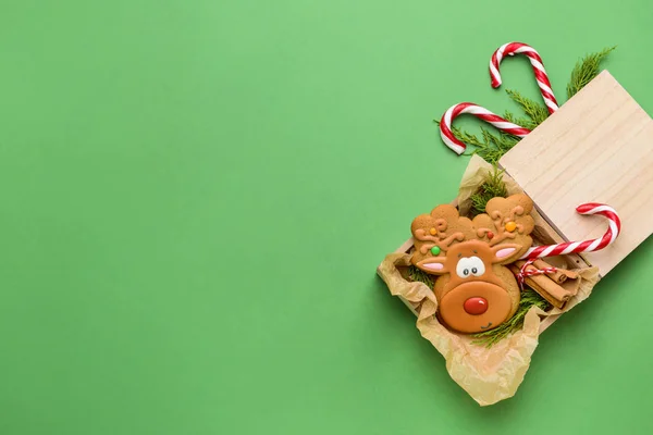 Box with tasty Christmas cookie on color background — Stock Photo, Image