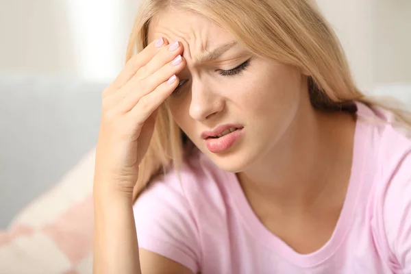 Stressed young woman at home — Stock Photo, Image