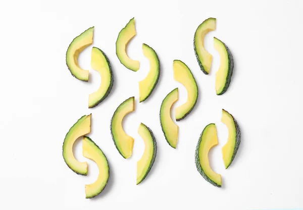 Sliced ripe avocado on white background — Stock Photo, Image