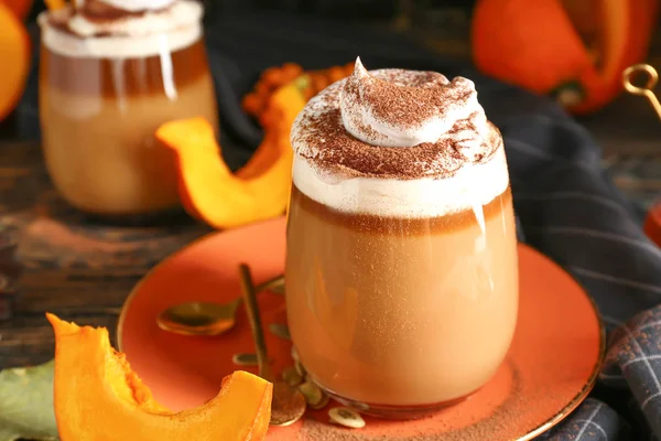 Glass of tasty pumpkin coffee on table — Stock Photo, Image