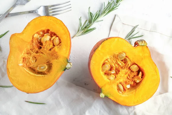 Cut pumpkin on white table — Stock Photo, Image