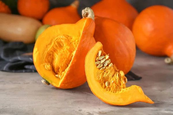 Fresh pumpkins on grunge table — Stock Photo, Image