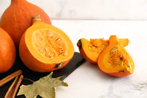 Fresh pumpkins on light table — Stock Photo, Image