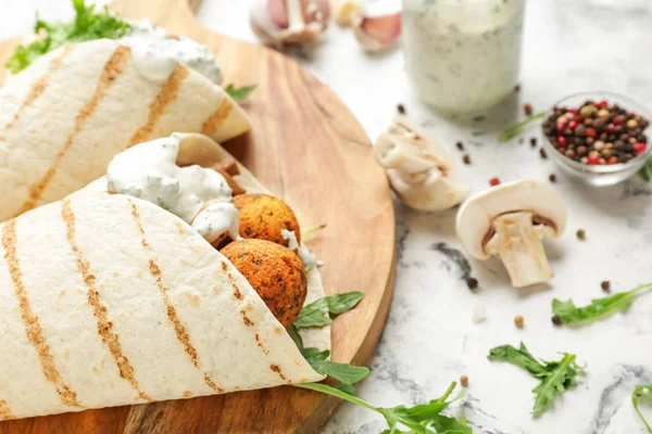 Tasty falafel pitas on light table, closeup — Stock Photo, Image