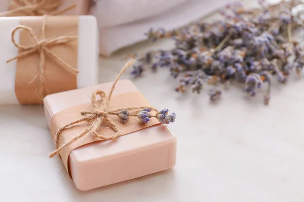 Soap bars and lavender on light background — Stock Photo, Image