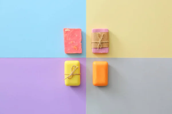 Different soap on color background — Stock Photo, Image