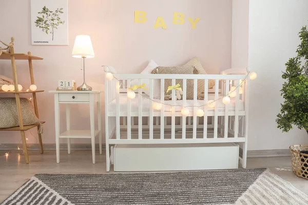 Stylish baby bed in interior of children's room — Stock Photo, Image