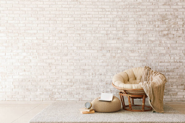 Armchair in stylish interior of living room