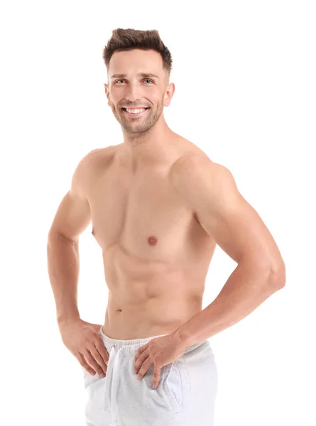 Hombre musculoso guapo sobre fondo blanco. Concepto de pérdida de peso — Foto de Stock