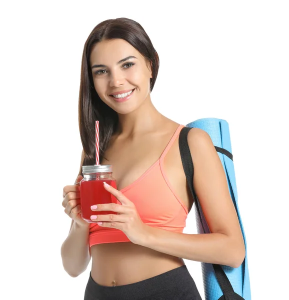 Young sporty woman with healthy juice on white background — Stock Photo, Image