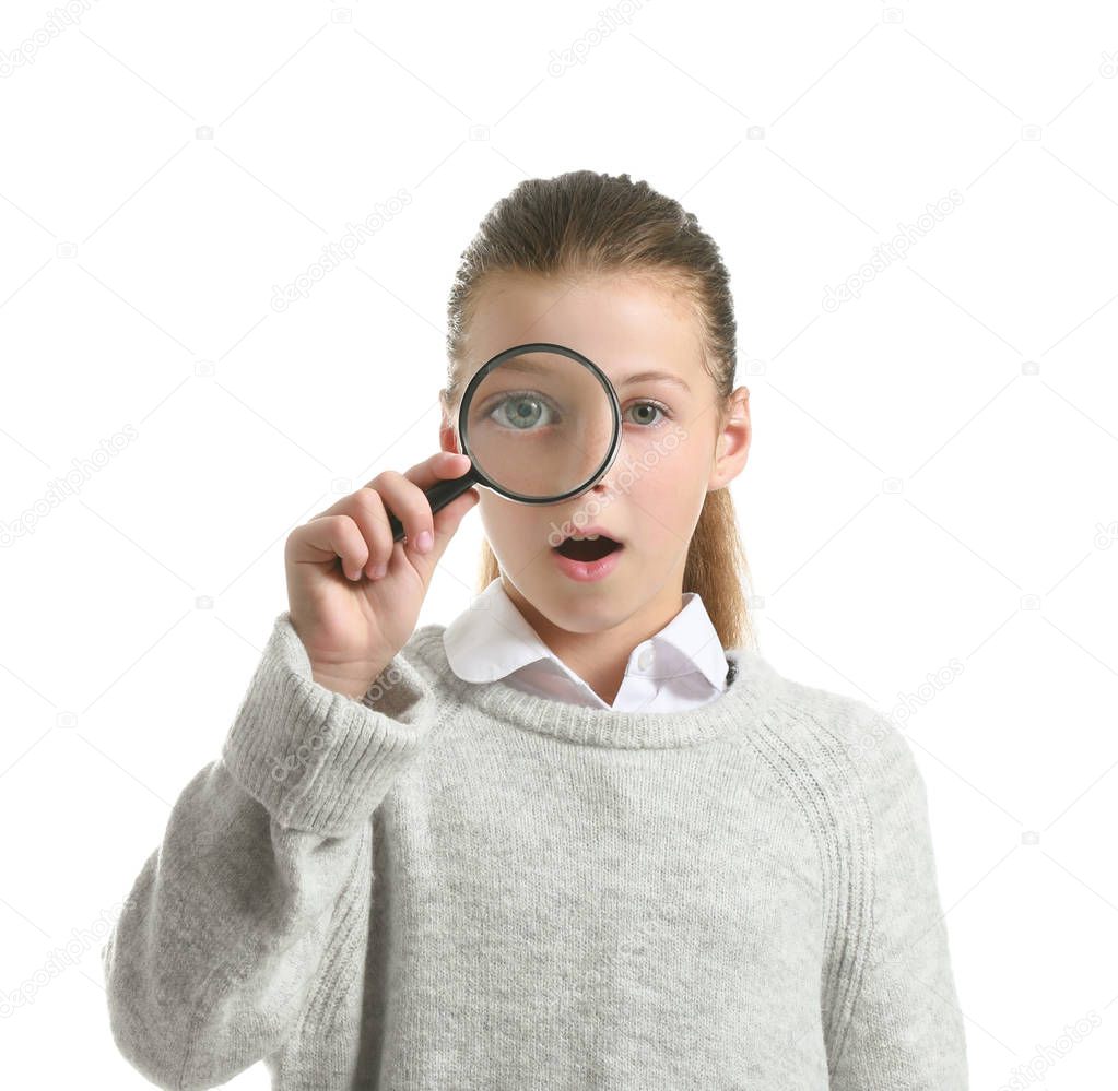 Surprised little girl with magnifying glass on white background