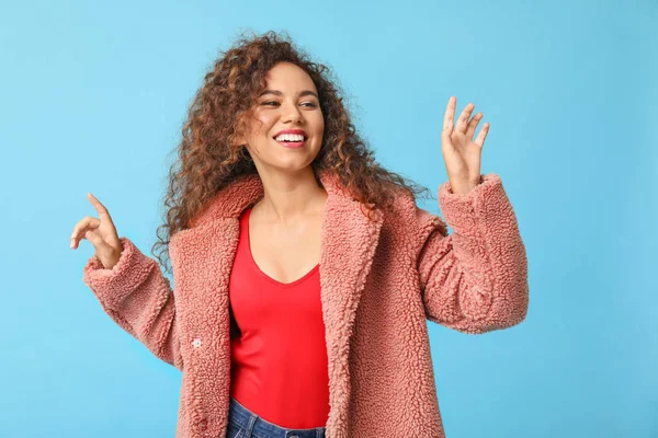 Happy African-American woman on color background — Stock Photo, Image