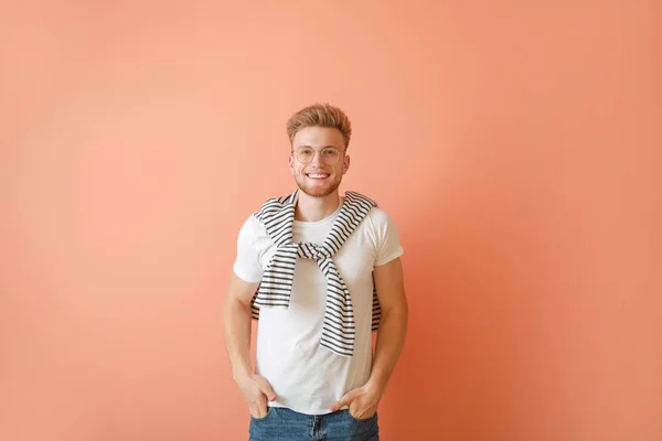 Man in stylish t-shirt on color background — Stock Photo, Image