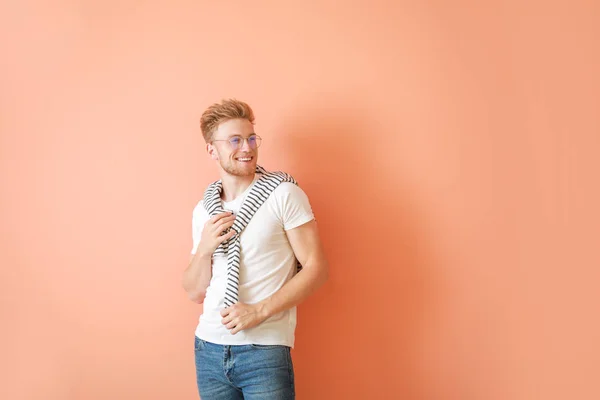 Man in stylish t-shirt on color background — Stock Photo, Image