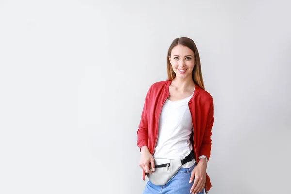 Woman in stylish t-shirt on light background — Stock Photo, Image