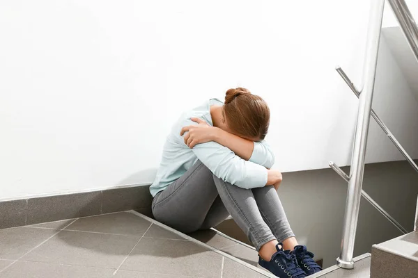 Woman having panic attack in the stairway — Stock Photo, Image