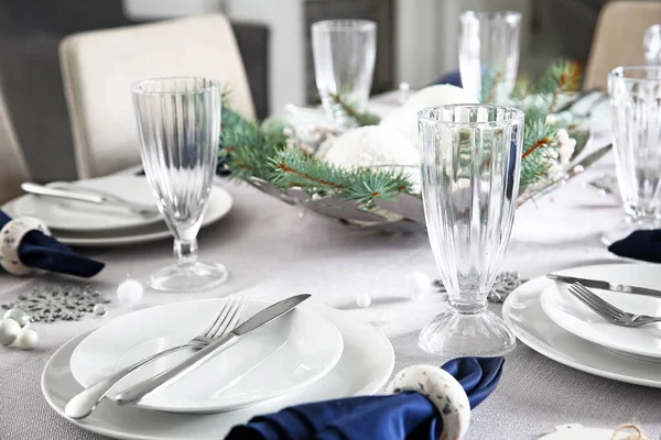 Festive table setting for Christmas dinner at home