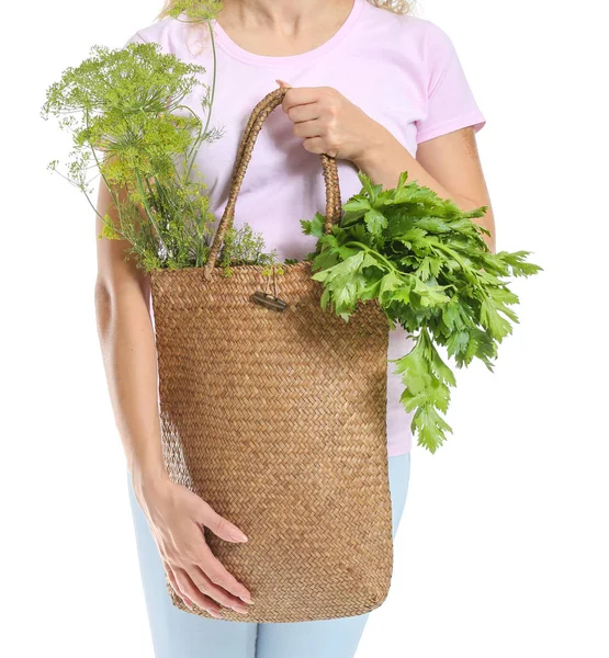 Woman with fresh herbs in eco bag on white background, closeup — Stock Photo, Image