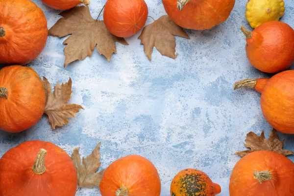 Frame made of fresh pumpkins on color background — Stock Photo, Image