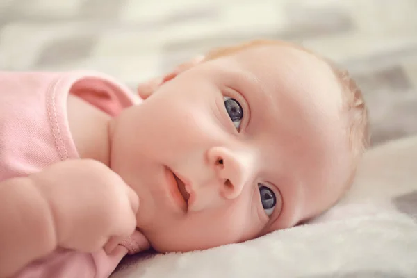 Cute little baby lying on bed — Stock Photo, Image