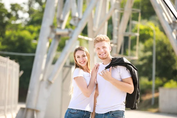 Man and woman in stylish t-shirts outdoors — Stock Photo, Image