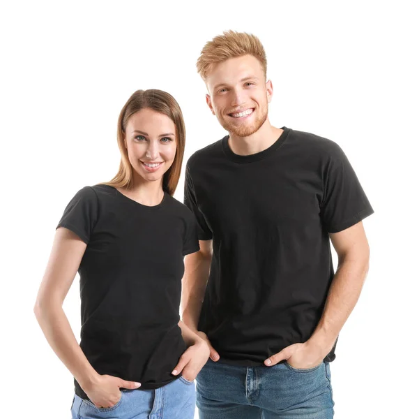 Couple in stylish t-shirts on white background — Stock Photo, Image