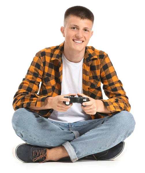 Teenage boy playing video game on white background — Stock Photo, Image