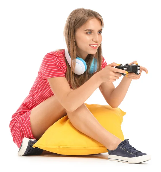 Teenage girl playing video game on white background — Stock Photo, Image
