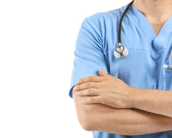 Male nurse with stethoscope on white background