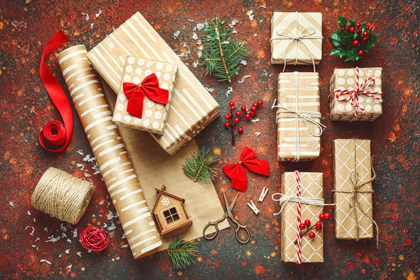 Beautiful Christmas gift boxes with decor on color background — Stock Photo, Image