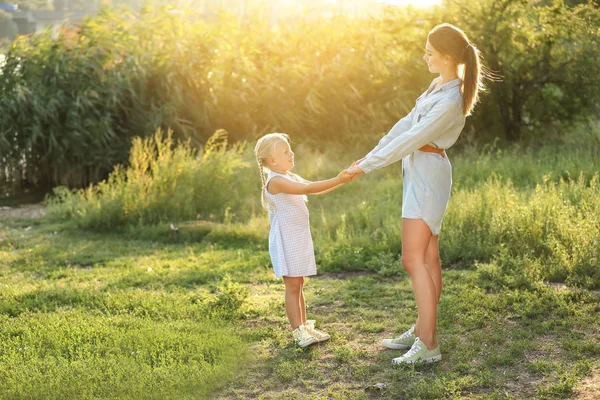 Happy mother and her little daughter in park — Stock Photo, Image