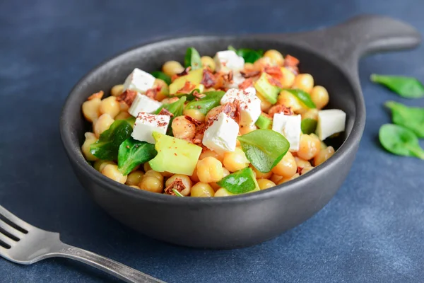 Bowl with tasty chickpea salad on table — Stock Photo, Image