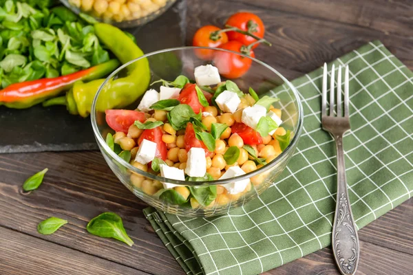 Bowl with tasty chickpea salad on table — Stock Photo, Image