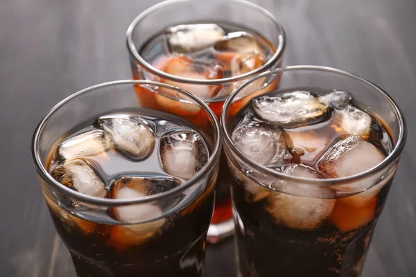 Glasses of cold cola on table, closeup — Stock Photo, Image