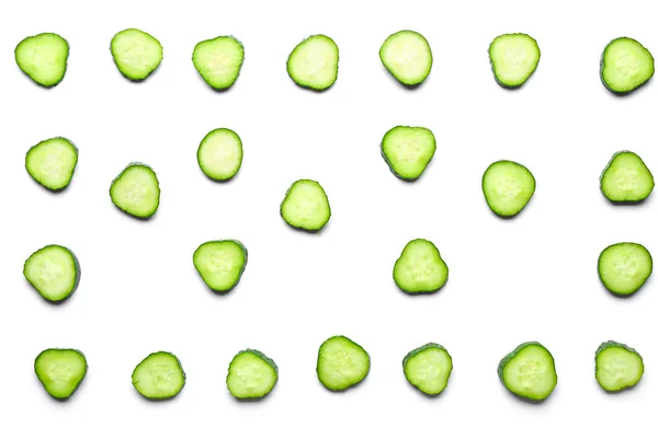 Many slices of cucumber on white background — Stock Photo, Image