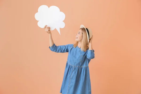 Happy woman with speech bubble on color background — Stock Photo, Image