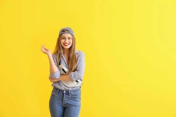 Happy young woman on color background