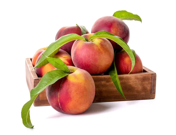 Box with ripe peaches on white background — Stock Photo, Image