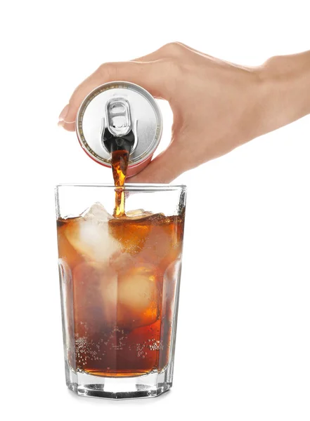 Woman pouring cola into glass on white background — Stock Photo, Image