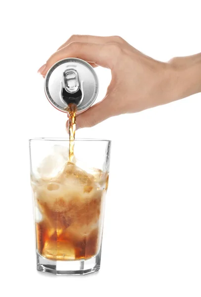 Woman pouring cola into glass on white background — Stock Photo, Image