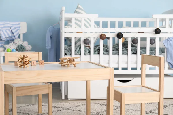 Interior of modern baby room with crib — Stock Photo, Image