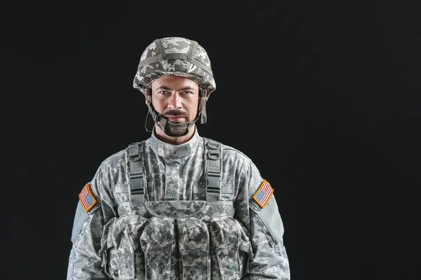 Soldier in camouflage on dark background — Stock Photo, Image