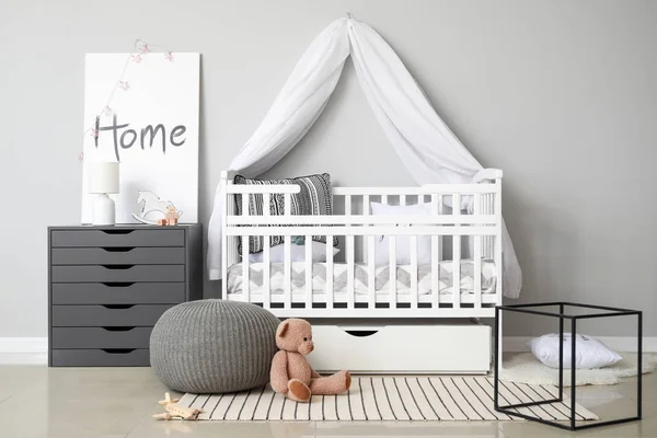 Interior of modern baby room with crib — Stock Photo, Image