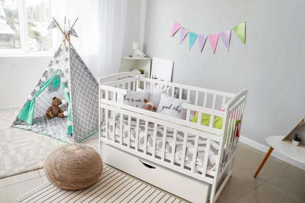 Interior of modern baby room with crib — Stock Photo, Image