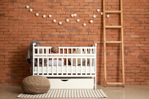 Interior of modern baby room with crib